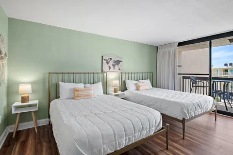a bedroom with a bed and a night stand