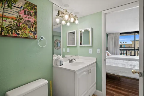 a bathroom with a sink a vanity and a mirror