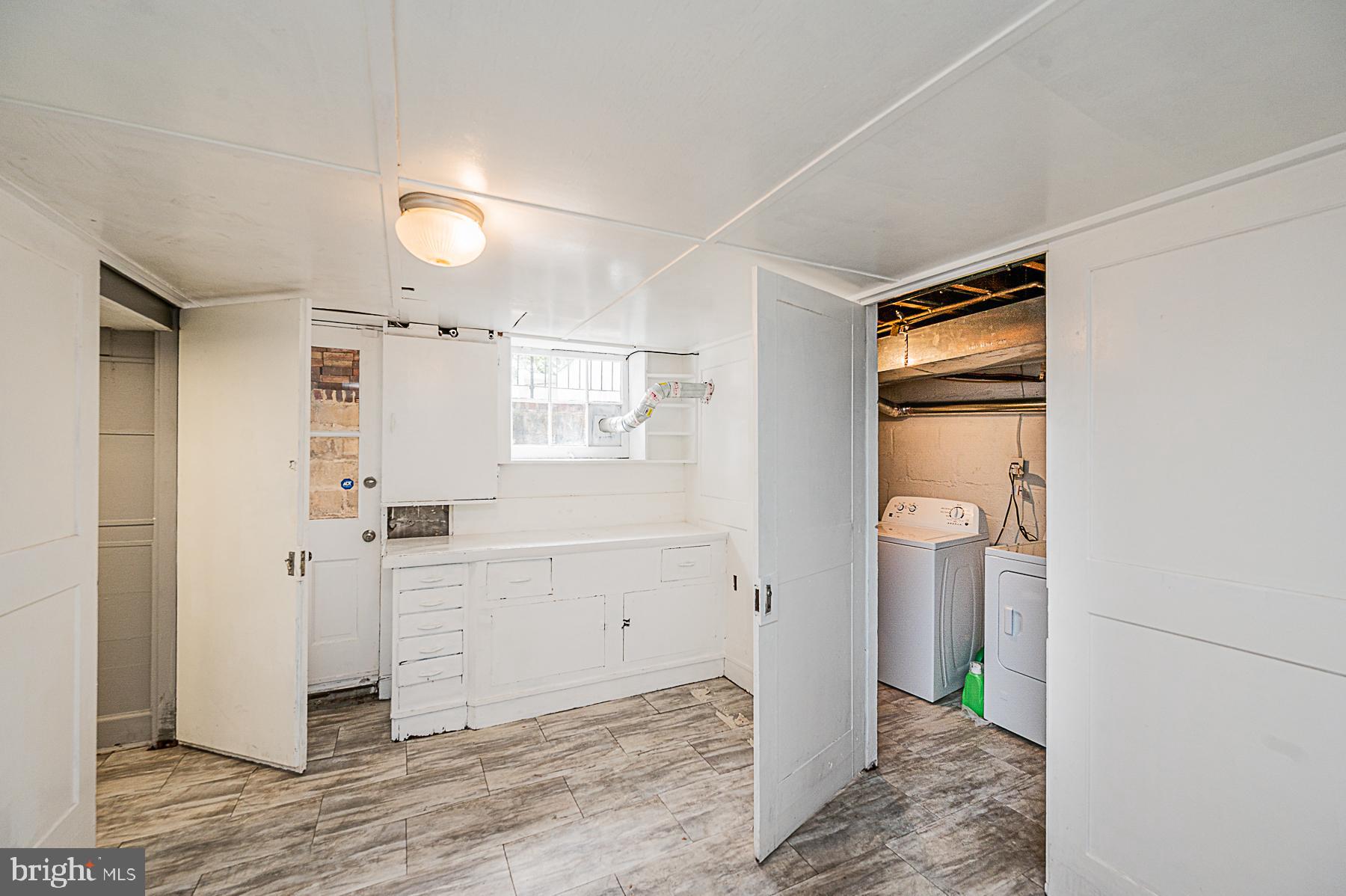 706 Braeside Road Baltimore, MD 21229 - Photo 22 of 28 Basement Utility Bench and Laundry