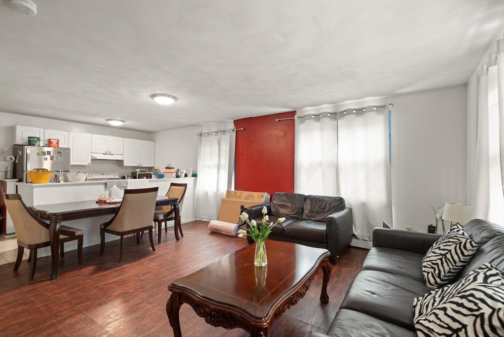 138 Franklin Street Lynn, MA 01902 - Photo 4 of 13 a living room with furniture a wooden floor and a window