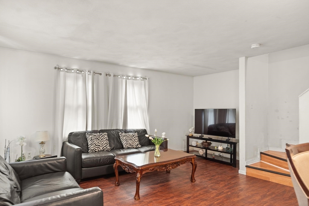 138 Franklin Street Lynn, MA 01902 - Photo 9 of 13 a living room with furniture and a flat screen tv