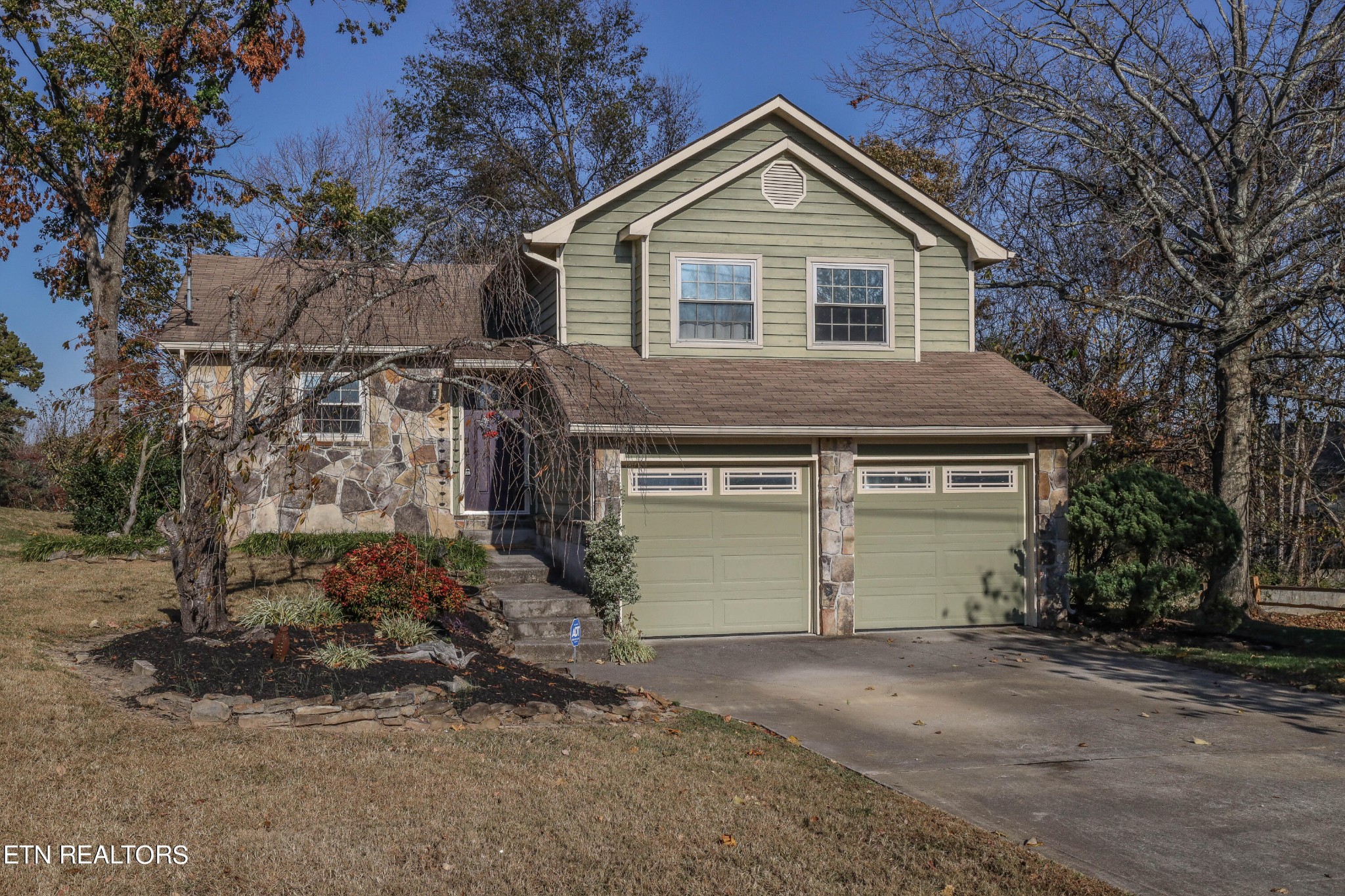 1340 Windamere Road Knoxville, TN 37923 - Photo 1 of 53 a front view of a house with a yard and garage
