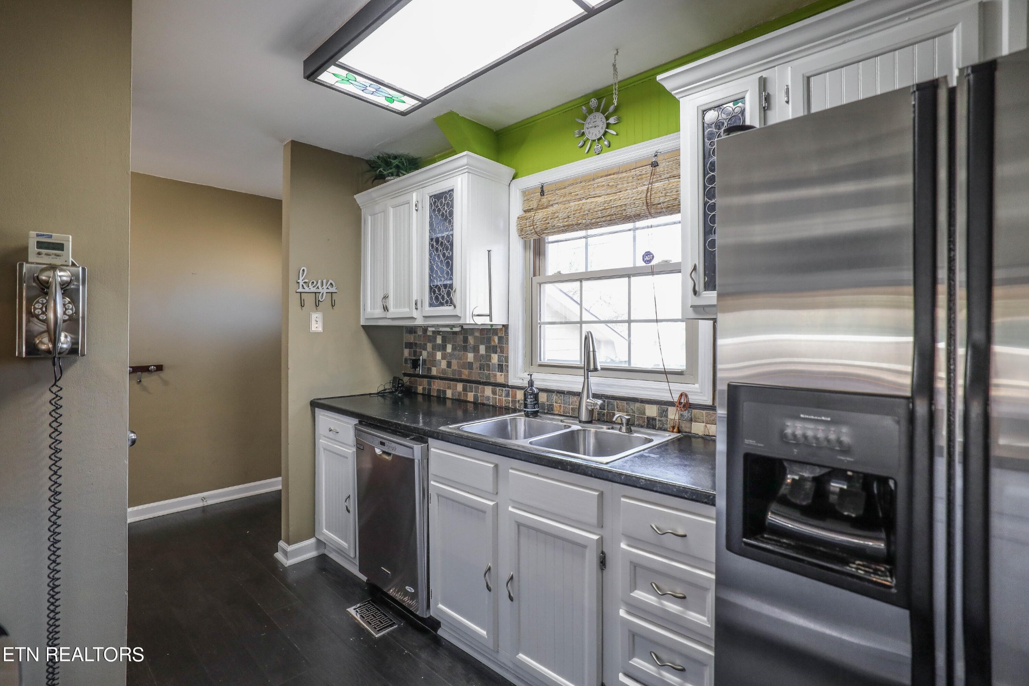 1340 Windamere Road Knoxville, TN 37923 - Photo 20 of 53 a kitchen with stainless steel appliances granite countertop a sink stove and refrigerator