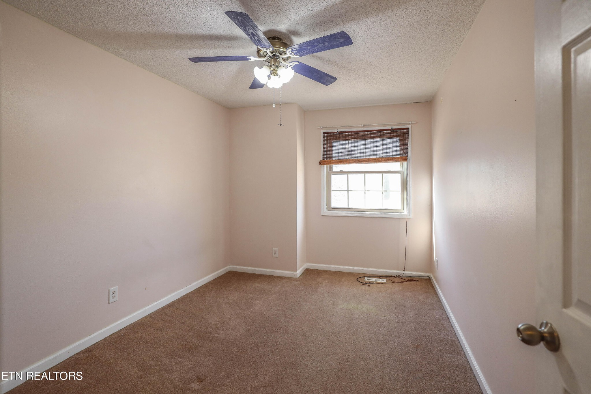 1340 Windamere Road Knoxville, TN 37923 - Photo 29 of 53 an empty room with a window and a fan