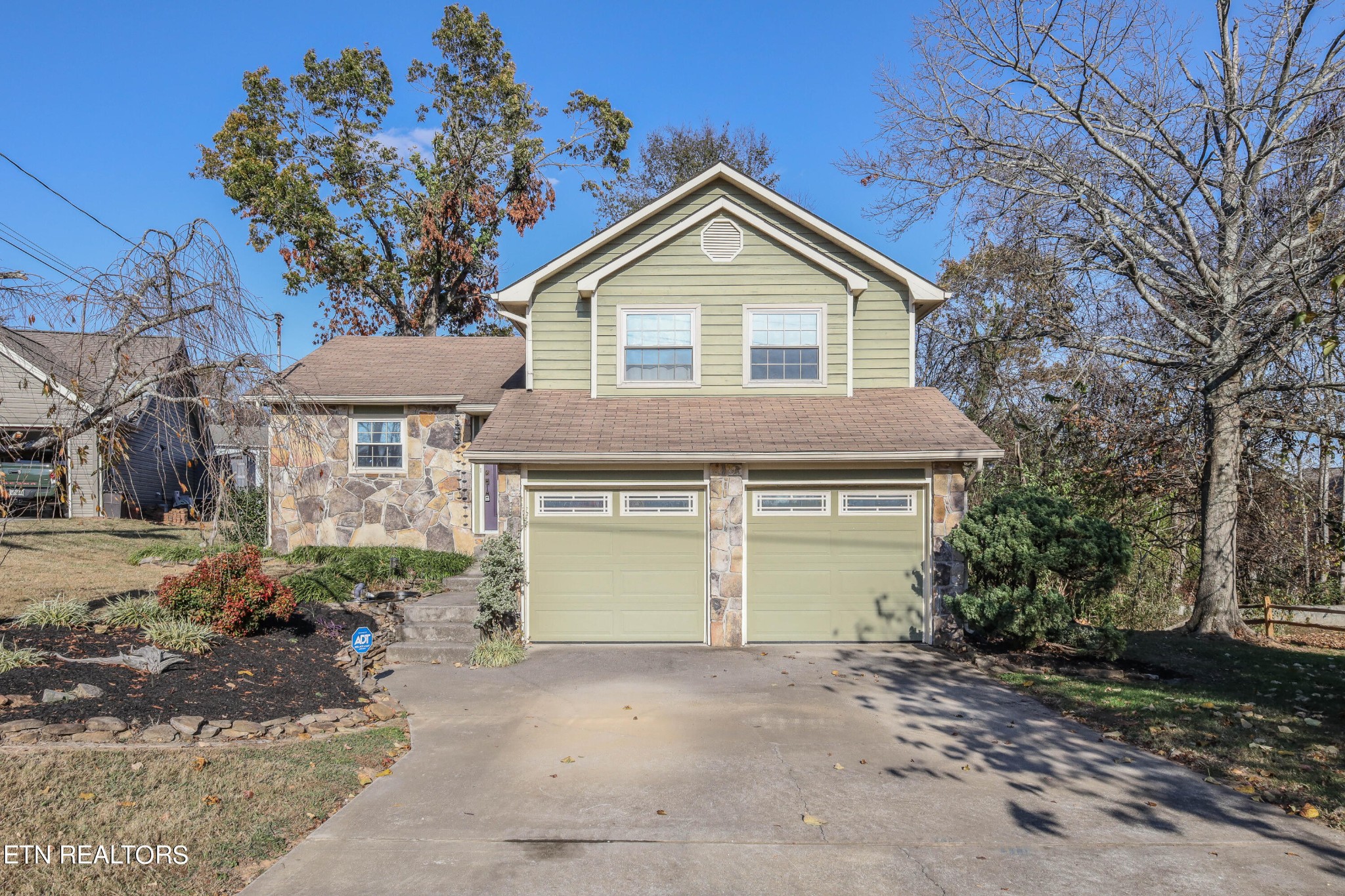 1340 Windamere Road Knoxville, TN 37923 - Photo 3 of 53 a front view of a house with a yard and garage