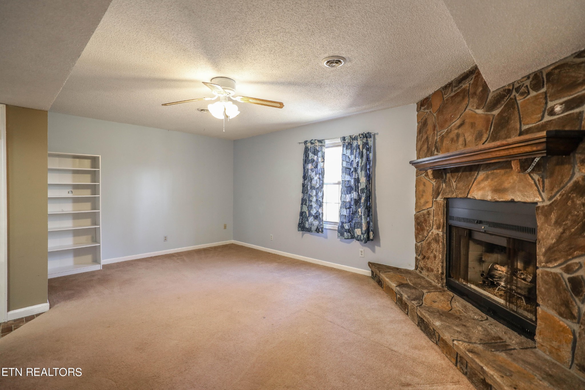 1340 Windamere Road Knoxville, TN 37923 - Photo 47 of 53 an empty room with windows and fireplace