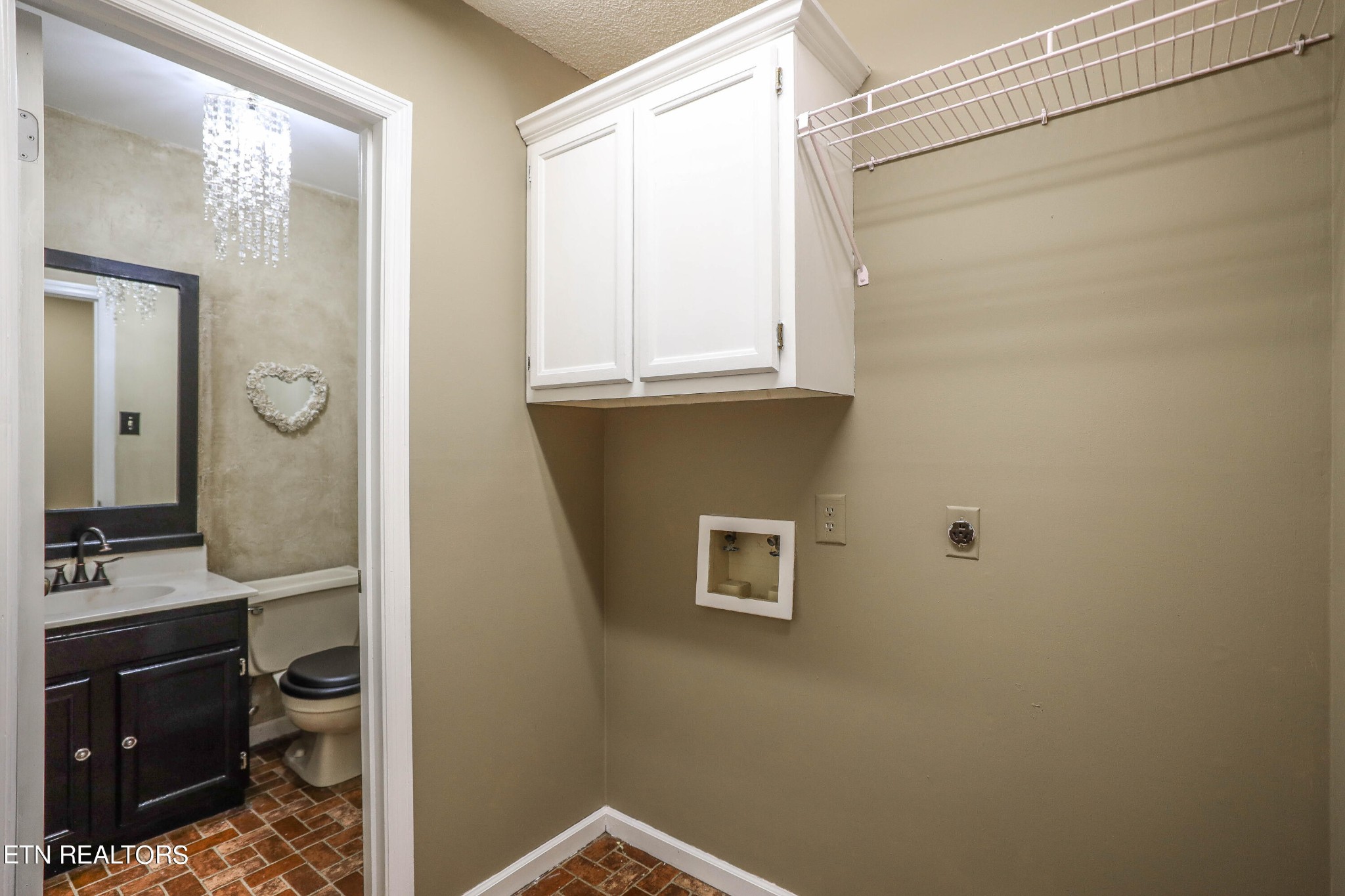 1340 Windamere Road Knoxville, TN 37923 - Photo 50 of 53 a bathroom with a sink and a mirror