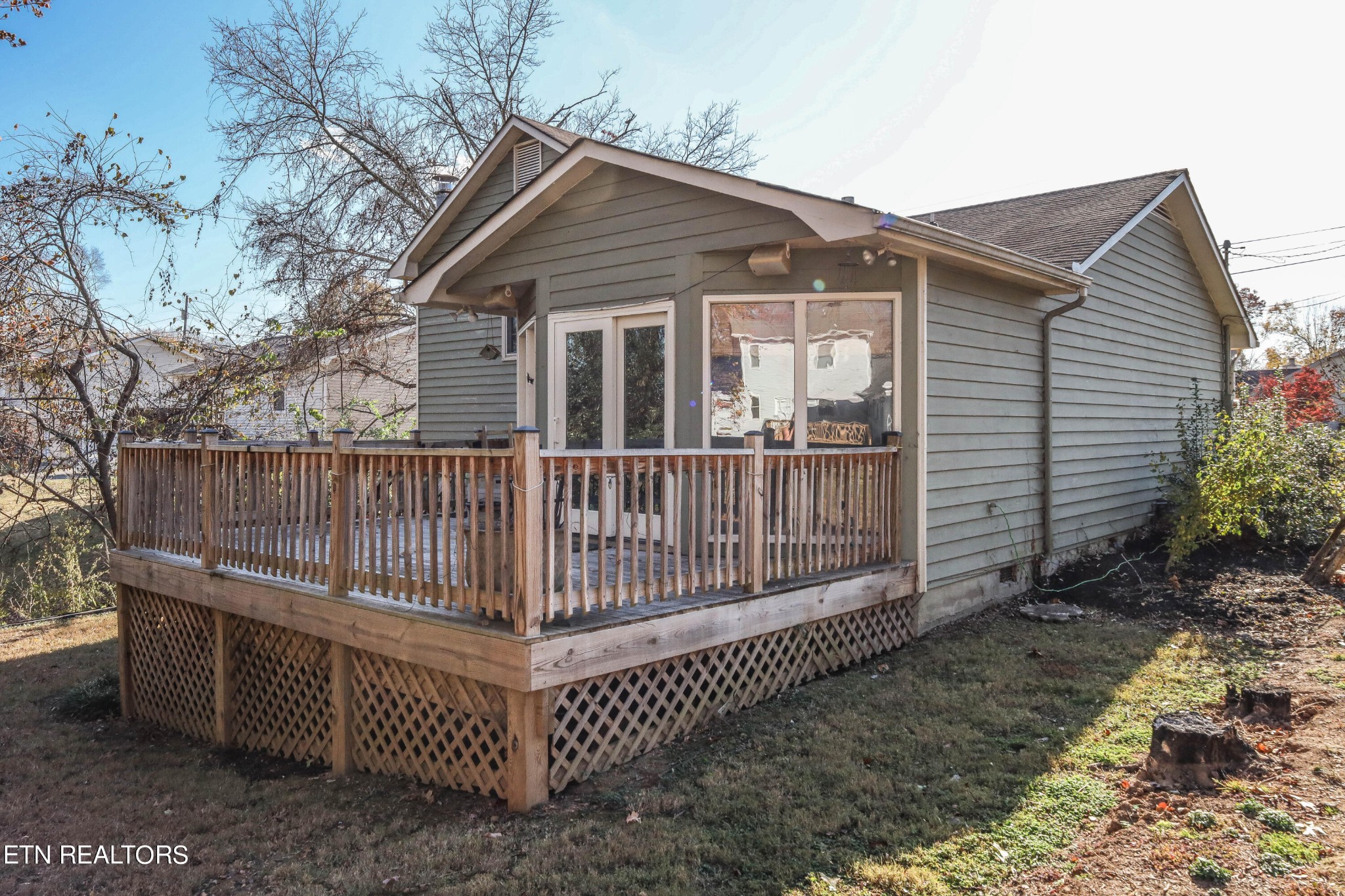 1340 Windamere Road Knoxville, TN 37923 - Photo 5 of 53 a view of a house with a small yard and wooden fence