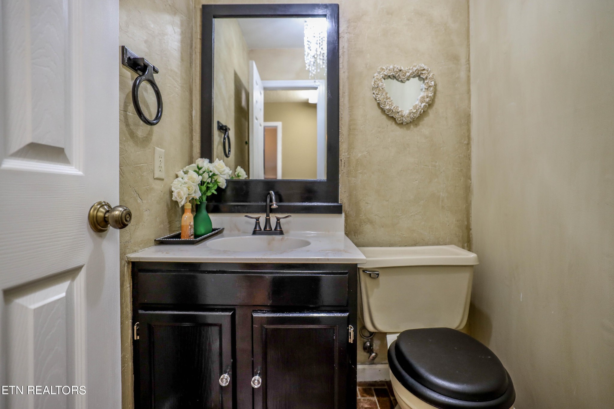 1340 Windamere Road Knoxville, TN 37923 - Photo 51 of 53 a bathroom with a toilet a sink and mirror
