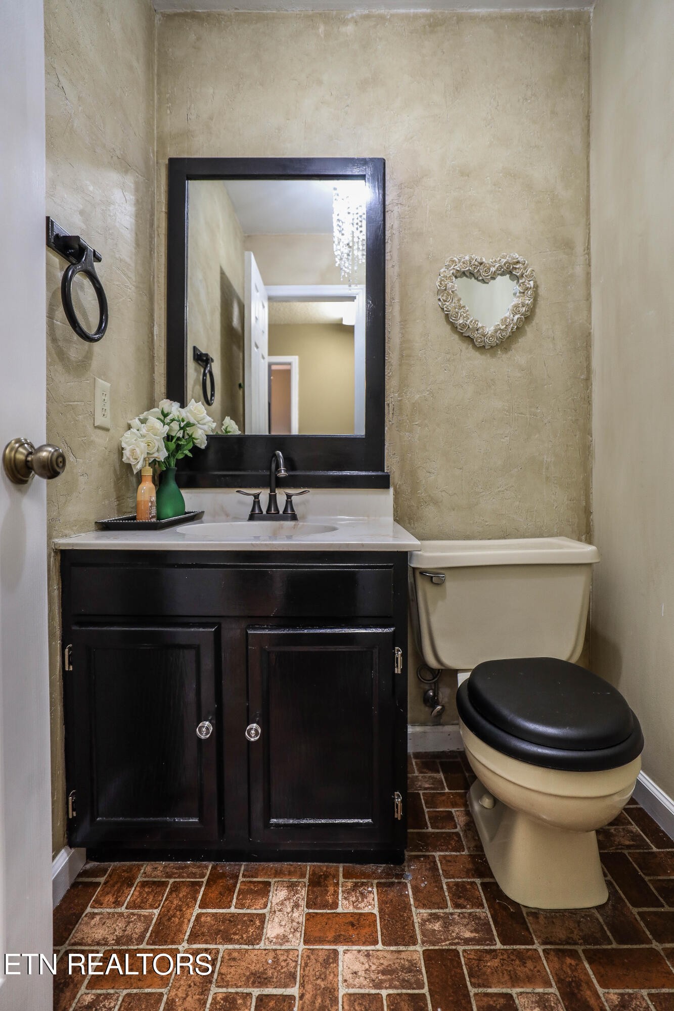 1340 Windamere Road Knoxville, TN 37923 - Photo 52 of 53 a bathroom with a sink and a mirror