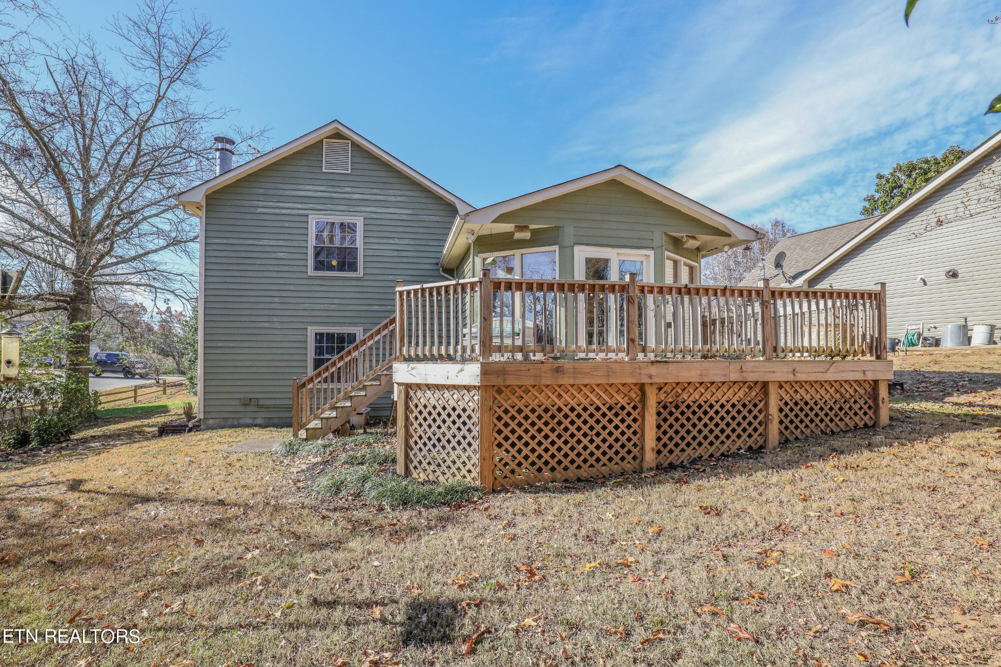 1340 Windamere Road Knoxville, TN 37923 - Photo 10 of 53 a view of a brick house with wooden fence