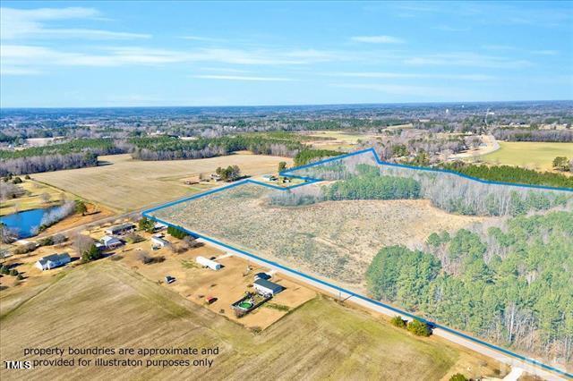 67 Rice Road Zebulon, NC 27597 - Photo 3 of 22 an aerial view of residential houses with outdoor space