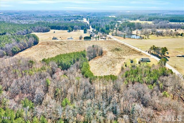 67 Rice Road Zebulon, NC 27597 - Photo 6 of 22 a view of a lake with a mountain