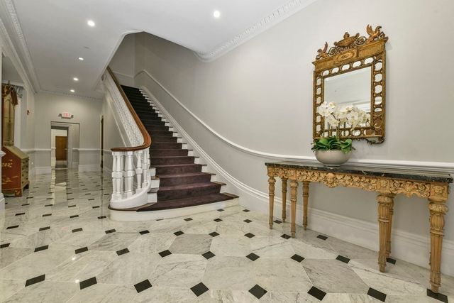 a view of a hallway with front door