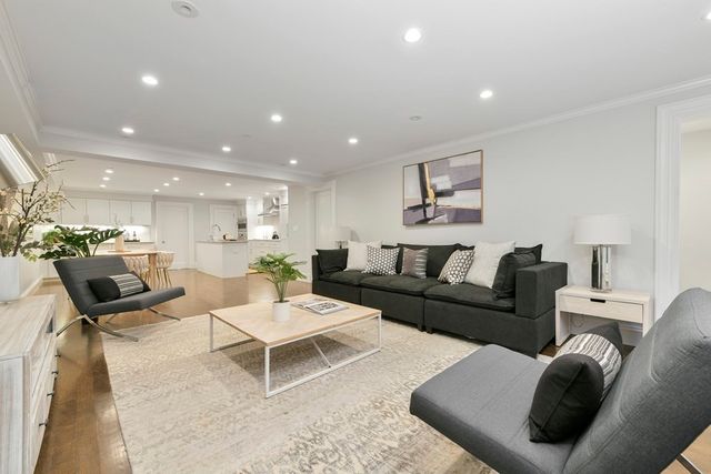 a living room with furniture and a rug