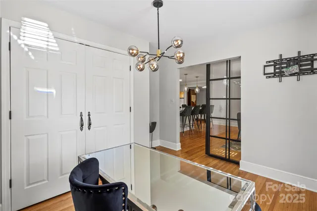 a bathroom with a granite countertop sink a toilet and a mirror