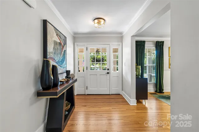 a view of a entryway door with wooden floor