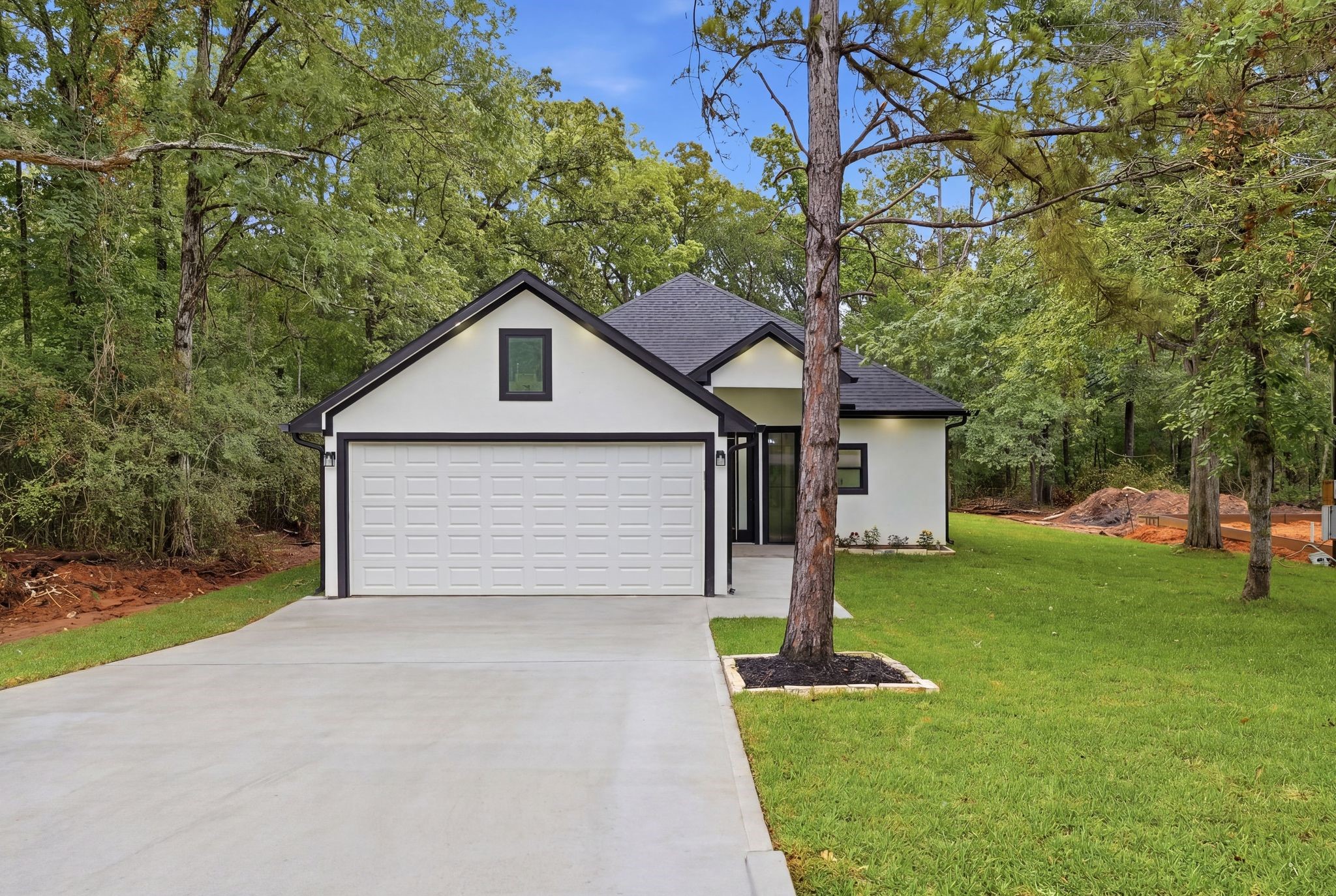 3575 Roy Bean Road Willis, TX 77378 - Photo 1 of 40 a front view of house with yard and green space