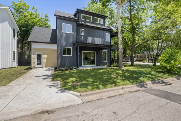 front view of a house with a yard
