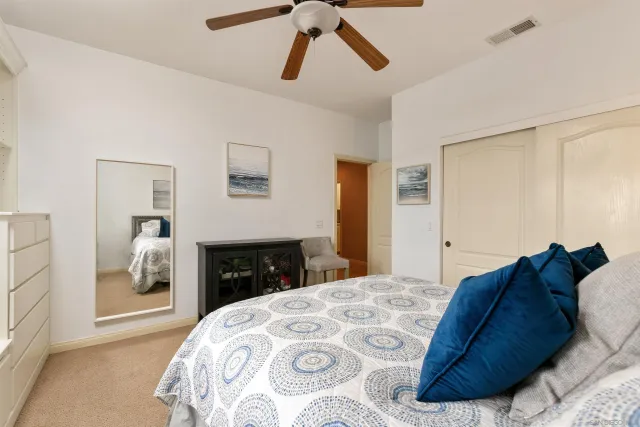 a bedroom with a bed and a dresser