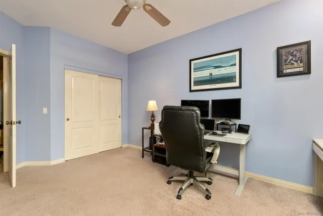 a view of a workspace with furniture