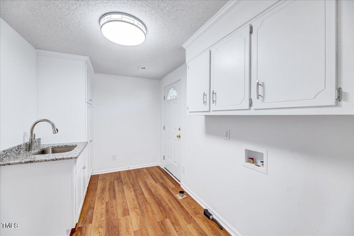 103 Allendale Road Four Oaks, NC 27524 - Photo 13 of 44 a view of a sink and cabinets