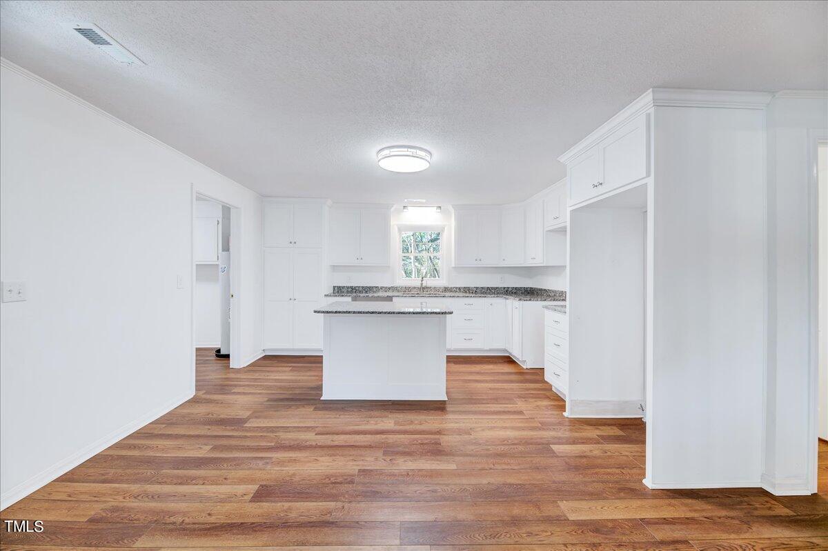 103 Allendale Road Four Oaks, NC 27524 - Photo 15 of 44 a view of kitchen with wooden floor