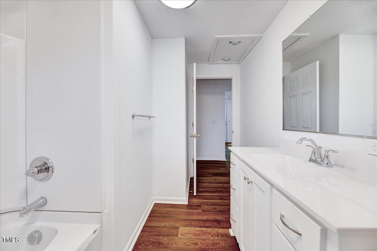 103 Allendale Road Four Oaks, NC 27524 - Photo 20 of 44 a bathroom with a sink and a mirror
