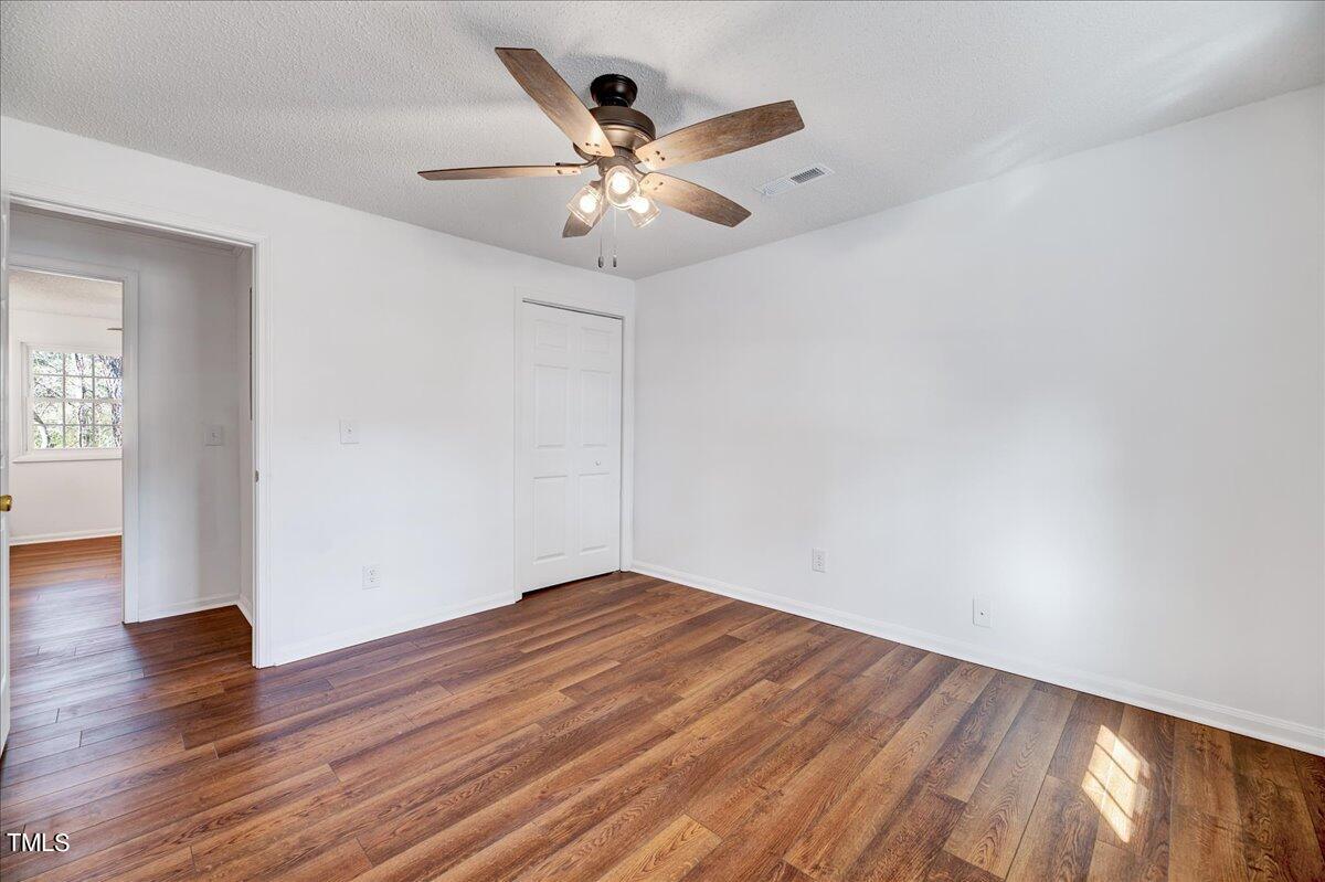 103 Allendale Road Four Oaks, NC 27524 - Photo 25 of 44 wooden floor in an empty room with a window