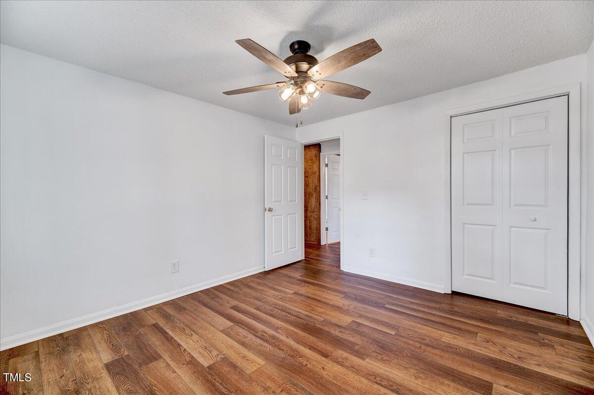 103 Allendale Road Four Oaks, NC 27524 - Photo 27 of 44 a view of an empty room with wooden floor