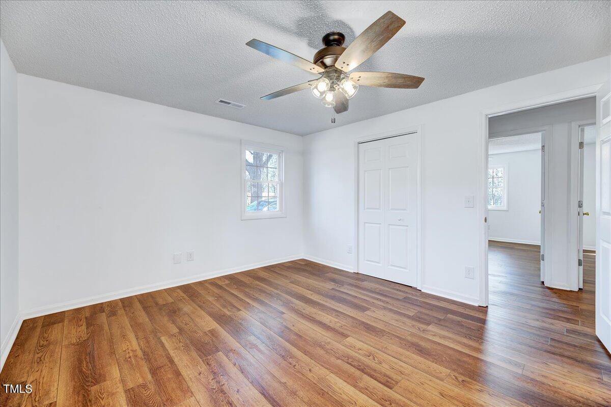 103 Allendale Road Four Oaks, NC 27524 - Photo 33 of 44 wooden floor in an empty room with a window