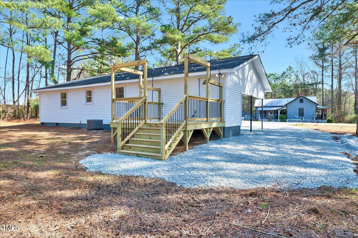 103 Allendale Road Four Oaks, NC 27524 - Photo 4 of 44 a view of a house with a yard patio and slide