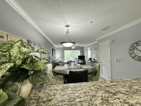 a view of a dining room with furniture