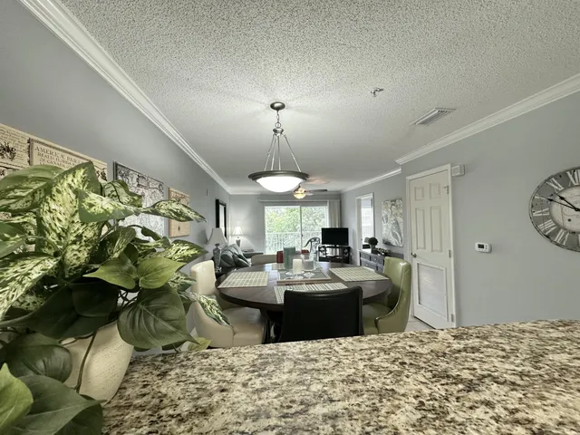 a view of a dining room with furniture
