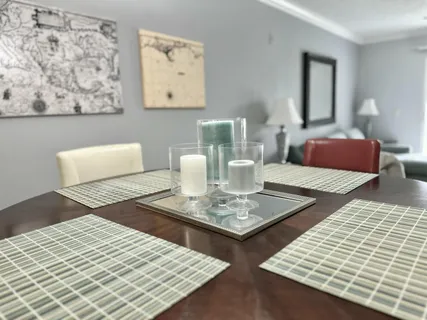 a living room with dining table and a couch