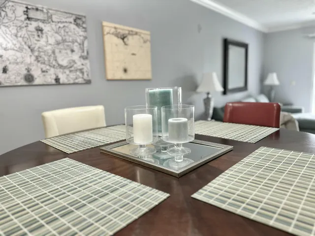 a living room with dining table and a couch