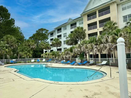 a view of a table and chairs in backyard