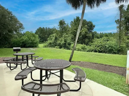 a front view of a garden with a fountain