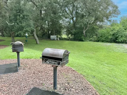 a view of a chairs and table in patio