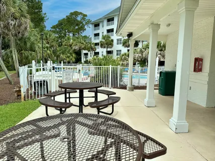 a view of a chairs and tables in the patio