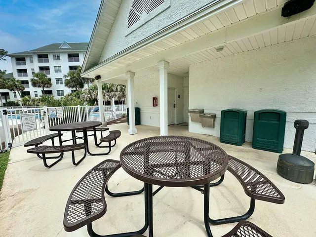 a view of a swimming pool with chairs