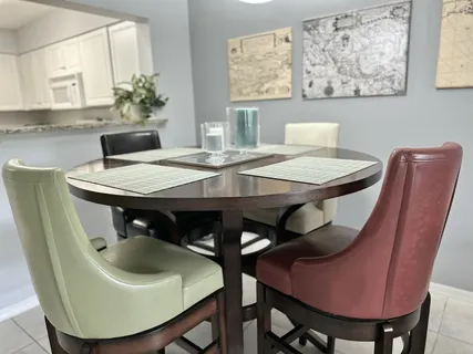 a kitchen with cabinets appliances a sink and a counter top