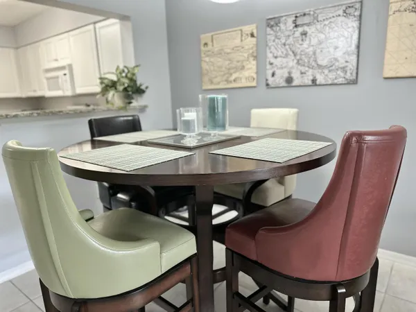 a kitchen with cabinets appliances a sink and a counter top