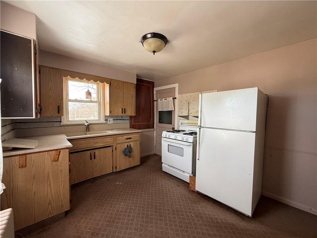 2703 20th St Extension Beaver Falls, PA 15010 - Photo 30 of 45 REAR HOME - large eat in kitchen.