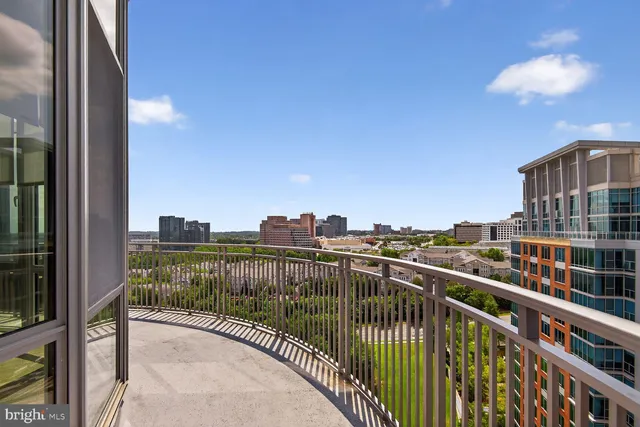 a view of a balcony with city view
