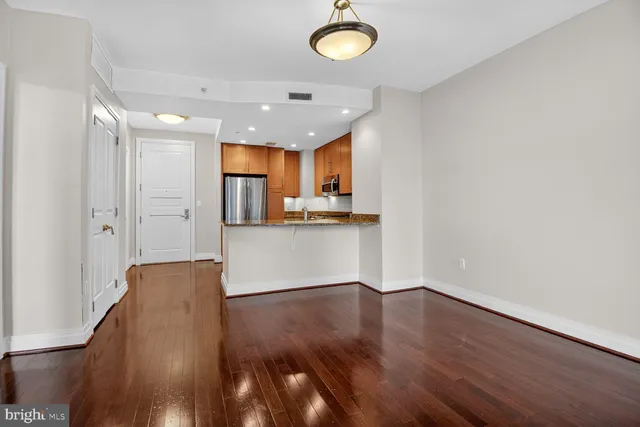 a view of kitchen with wooden floor and window