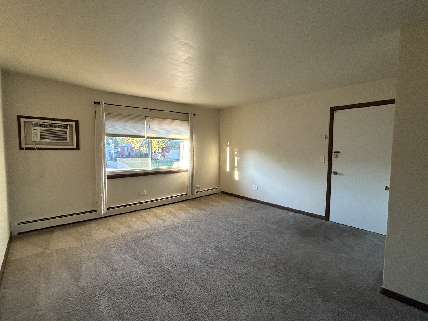 1300 Getzelman Drive, Unit 4 Elgin, IL 60123 - Photo 2 of 8 an empty room with windows