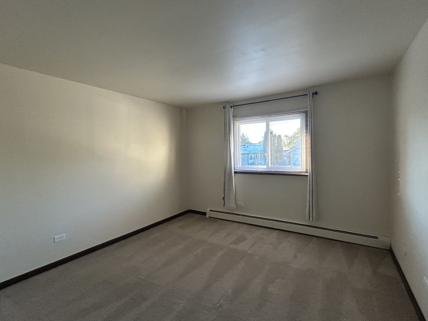 1300 Getzelman Drive, Unit 4 Elgin, IL 60123 - Photo 5 of 8 an empty room with a window
