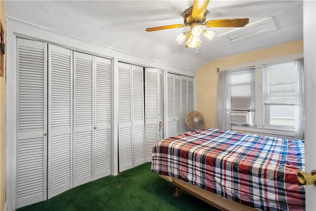 330 Main Street Richeyville, PA 15358 - Photo 18 of 28 a bedroom with a bed and a chandelier