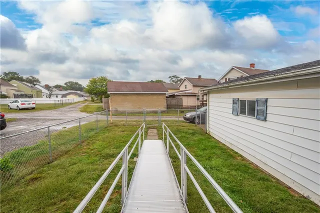 a view of balcony with two chairs and a table